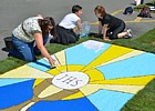 S.STEFANO DI MAGRA (Infiorata del Corpus Domini 2026) - Allestimento quadro di calice con ostia e scritta JHS in Piazza 25 Aprile