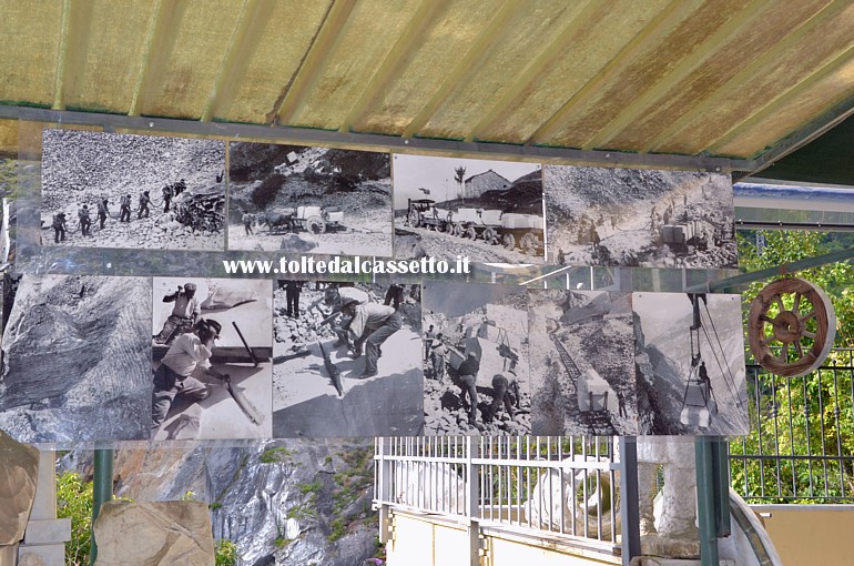 COLONNATA - Qualche chilometro prima di entrare in paese un negozio di artigianato locale e souvenirs espone alcune foto d'epoca che mostrano il lavoro manuale dei cavatori sui blocchi di marmo