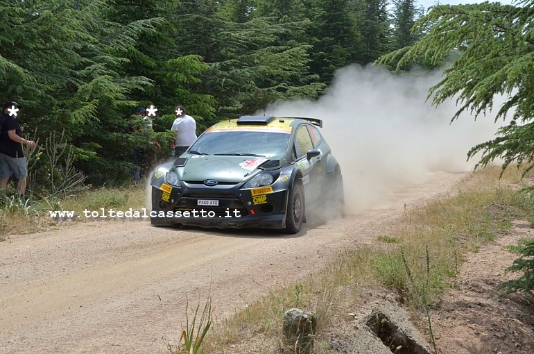 RALLY ITALIA SARDEGNA 2014 - La Ford Fiesta RRC S2000 (n.37) degli italiani Bertelli e Dotta (nono posto nella classifica finale) durante l'attraversamento di un tratto boschivo. I due hanno vinto la classifica delle auto iscritte al WRC2